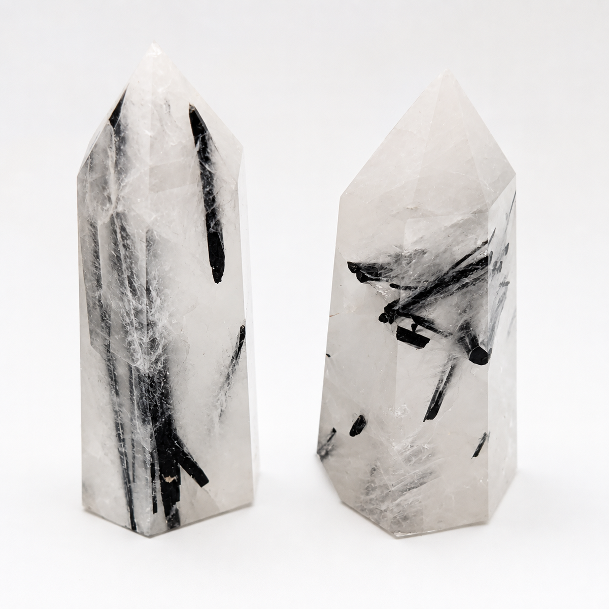 Two polished 5cm Black Tourmaline in Quartz crystal towers with natural black needle inclusions