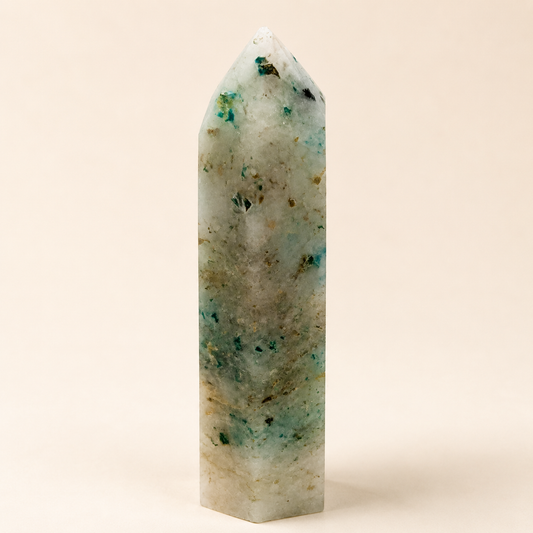 Phoenix Stone tower with pale quartz and green-blue inclusions, approximately 9cm