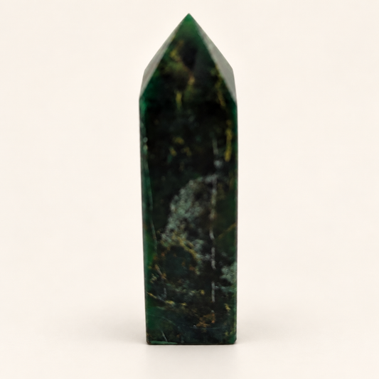 10 cm dark green Chinese Emerald Tower with lighter mottled markings against an ivory background